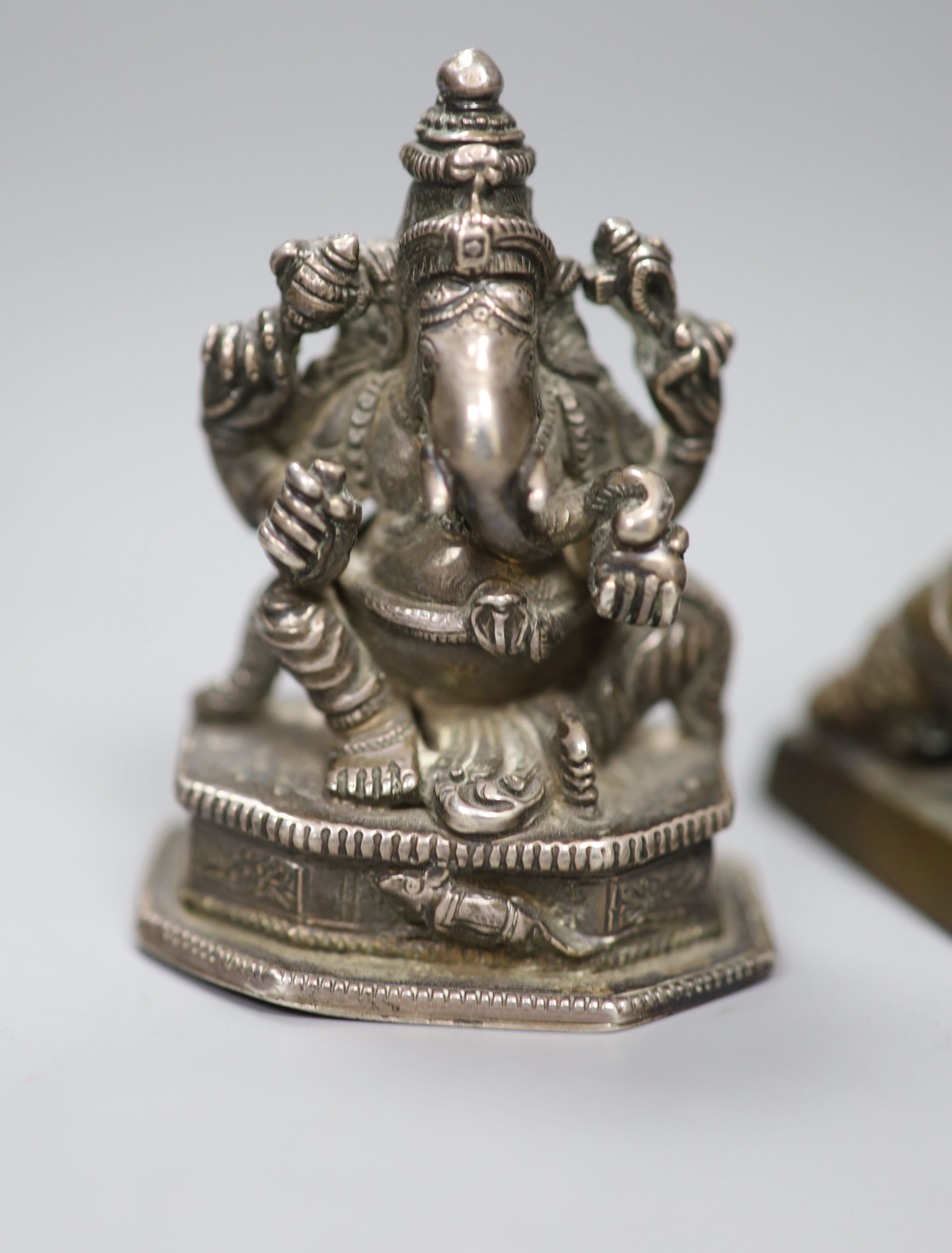 A group of Chinese bronze seals and a white metal elephant